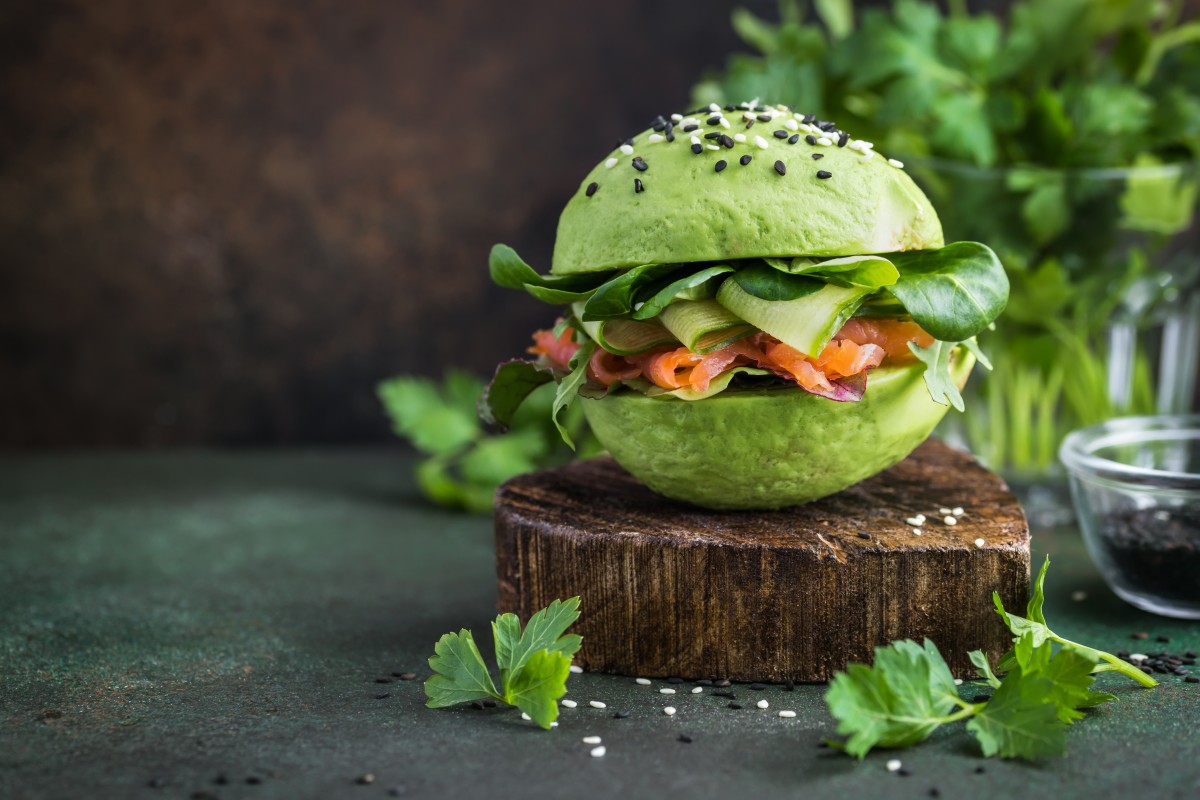 Avocado bun with cucumber ribbons, salmon and spinach