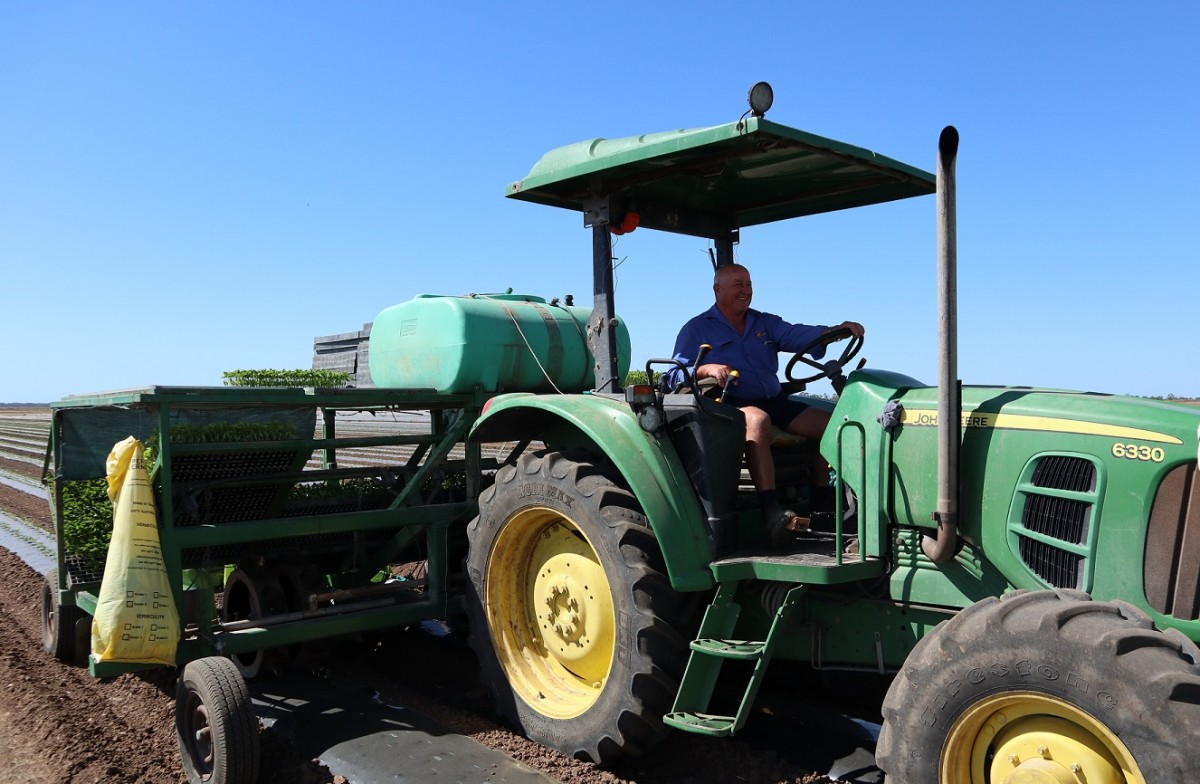 Des Chapman on tractor at Rocky Ponds Produce