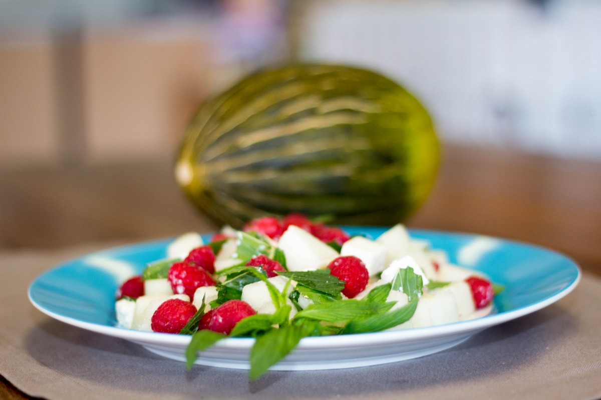 Piel de Sapo Melon salad with feta, mint and raspberries