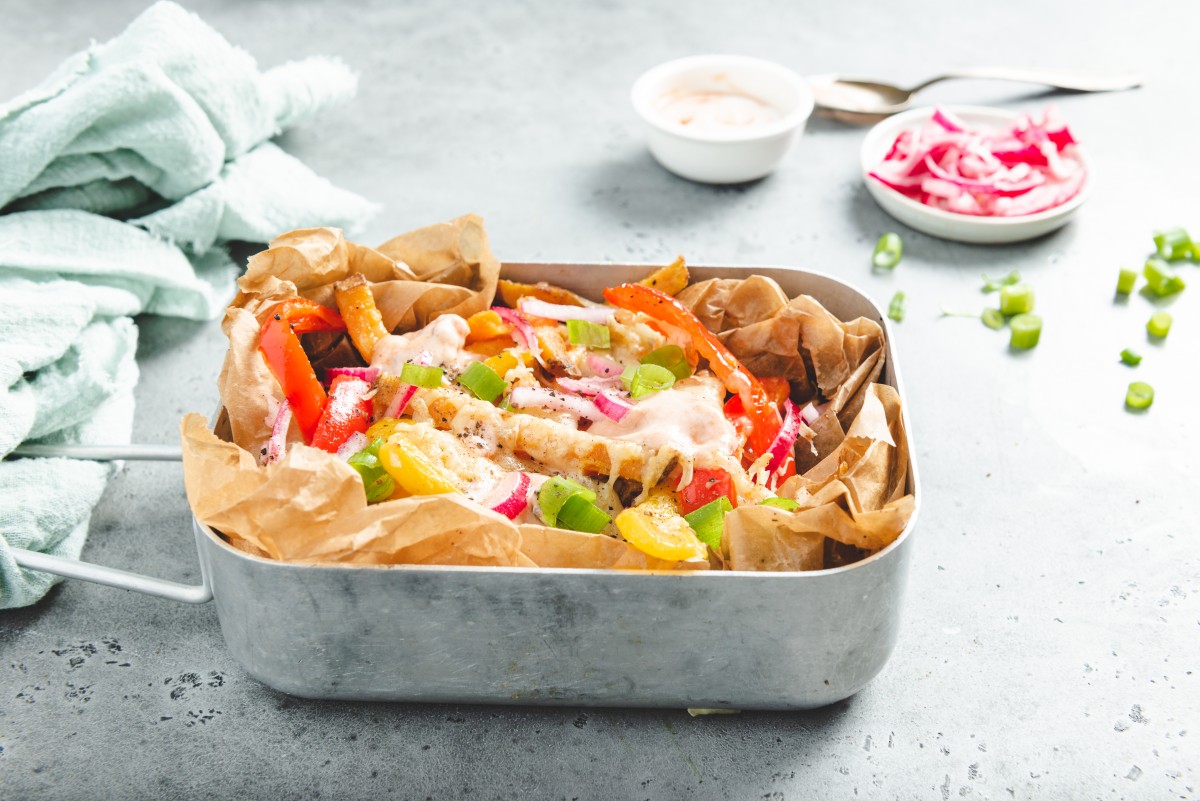 Loaded sweet potato and pointed pepper fries with cheese and sriracha