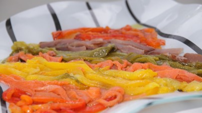 Colourful tapas of roasted peppers and smoked fish