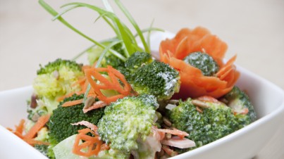 Broccoli salad with carrots, ham and roasted sunflower seeds