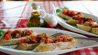 Classic Italian bruschetta with rocket and fresh tomatoes