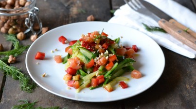 Easy zucchini noodles with capsicum, smoked trout and roasted hazelnuts