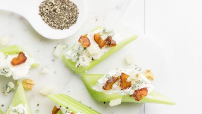 Cheesy celery snacks with nuts and fruit