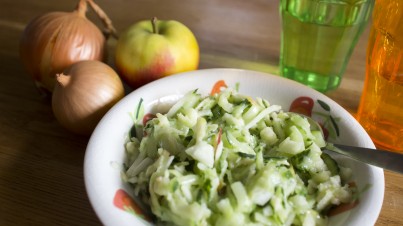 Three-ingredient side salad with cucumber, apple and onion