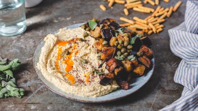 Loaded hummus with cooked eggplant and hot butter