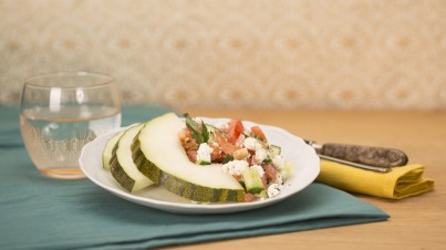 Melon with goat cheese, tomato and cucumber