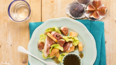 Melon salad with romaine lettuce, figs, prosciutto and balsamic dressing