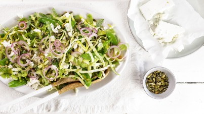 Pointed cabbage salad with onion, snow peas, feta and roasted pumpkin seeds