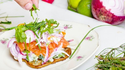 Waffle with salmon, avocado and red onion salad 