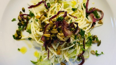 Celeriac salad with roasted onions and pumpkin seeds