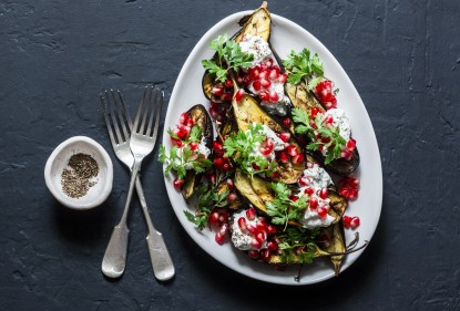 An elegant addition to your Christmas platter: eggplant with pomegranate, mint and a creamy tahini dressing