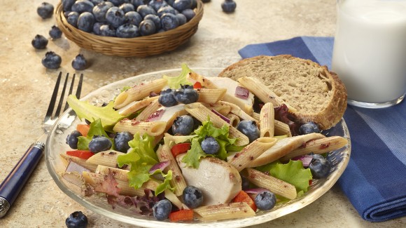 Blueberry and chicken pasta salad with field greens