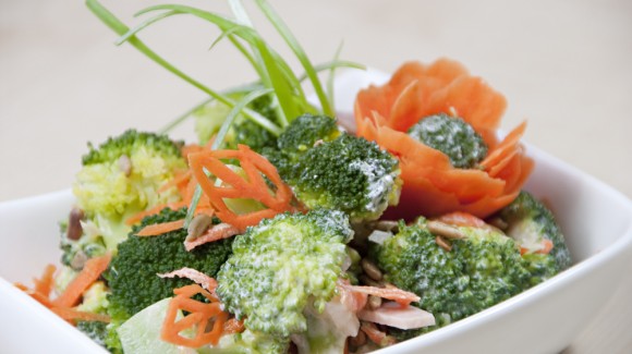 Broccoli salad with carrots, ham and roasted sunflower seeds