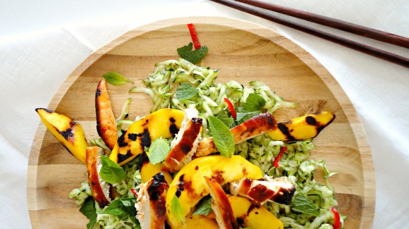 Fresh zucchini salad with spicy chicken and grilled mango