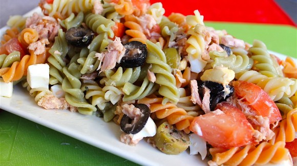 Pasta salad with egg, tuna, tomato and olives