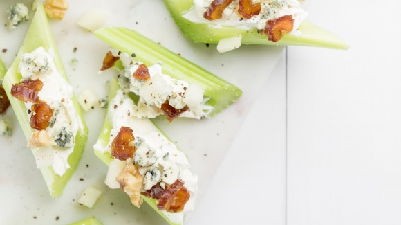 Cheesy celery snacks with nuts and fruit
