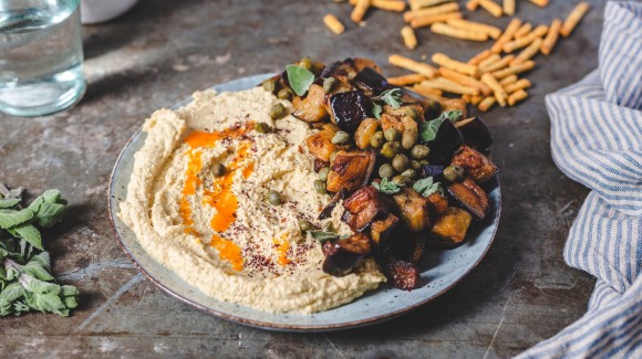 Loaded hummus with cooked aubergine and hot butter