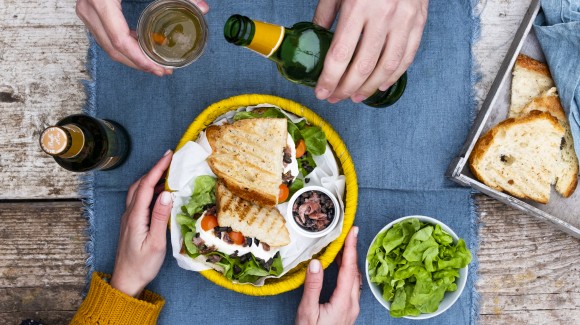 Luxury mozzarella sandwich with garlic tapenade, lettuce, tomatoes and anchovies