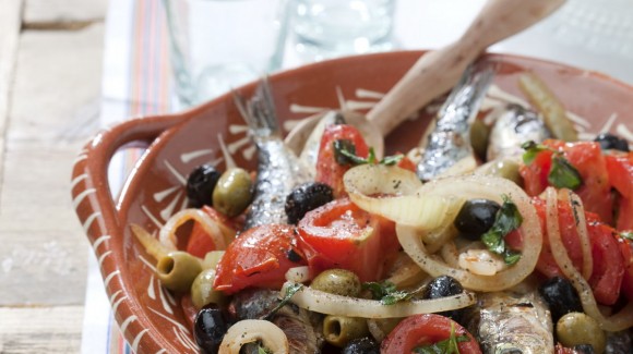 Portuguese oven baked sardine salad with tomato and olives