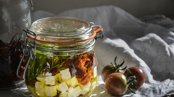 Marinated feta with sun-dried tomatoes, olive oil, garlic, and fresh herbs