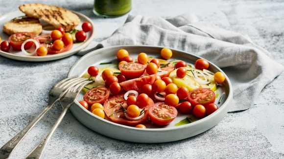 Tomato salad with pesto dressing